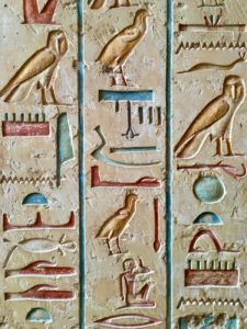 Egyptian hieroglyphics, like those pictured here, are among the oldest writing systems.