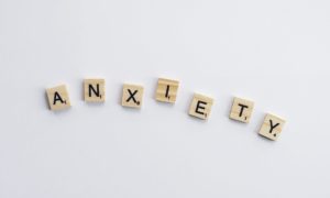 Scrabble tiles spell out "anxiety," one of the most common mental health disorders.