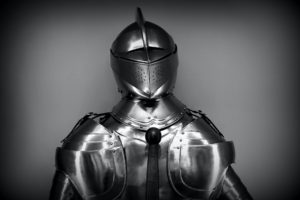 Grayscale photography of a medieval knight's armor.