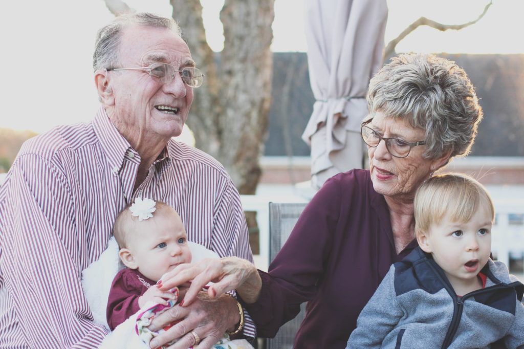 Older adults, like the ones pictured here, often want their adult children to reproduce, and not just because grandkids are cute.