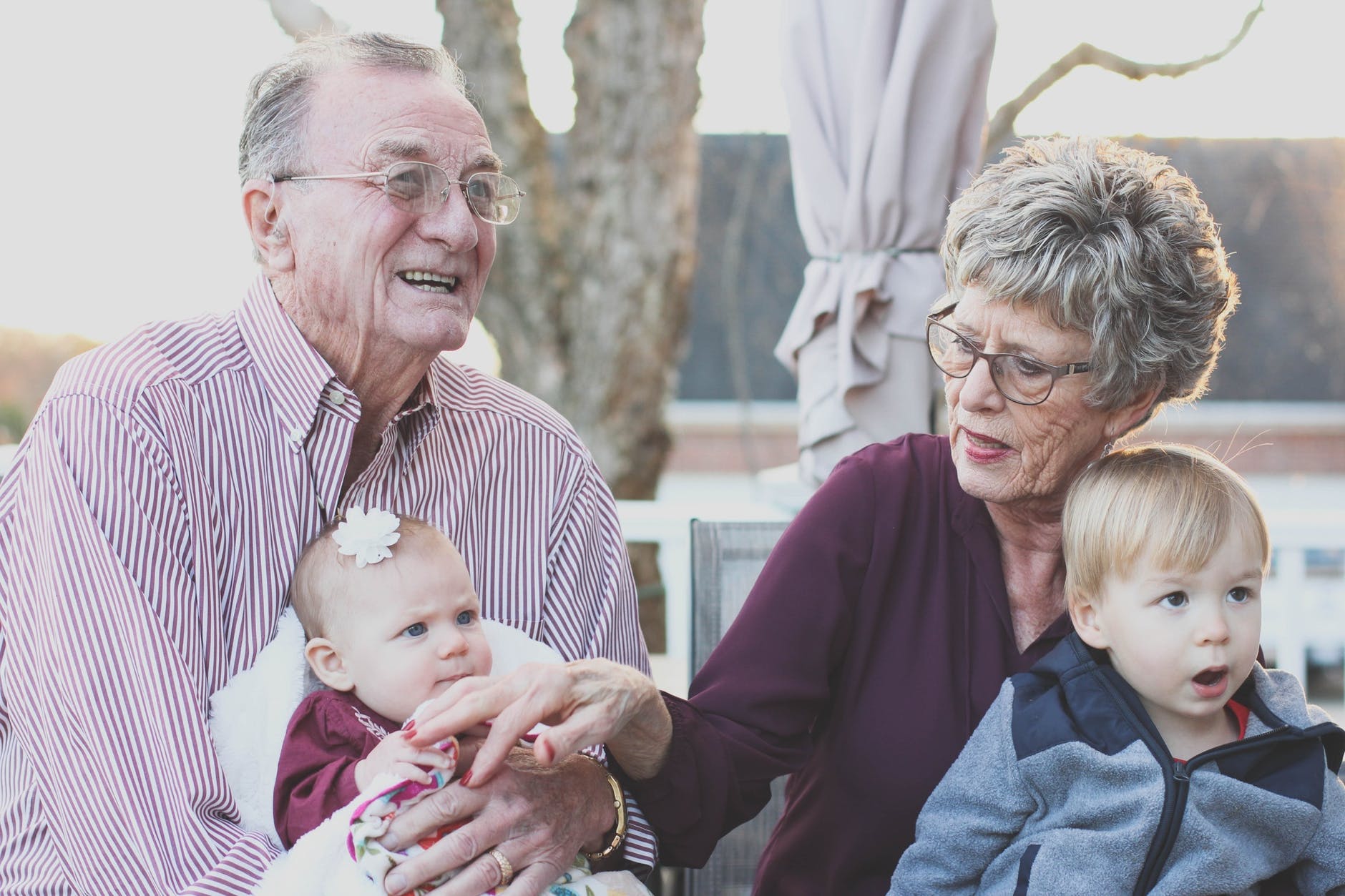 An older couple with their grandchildren. Clearly, these two have achieved genetic immortality.