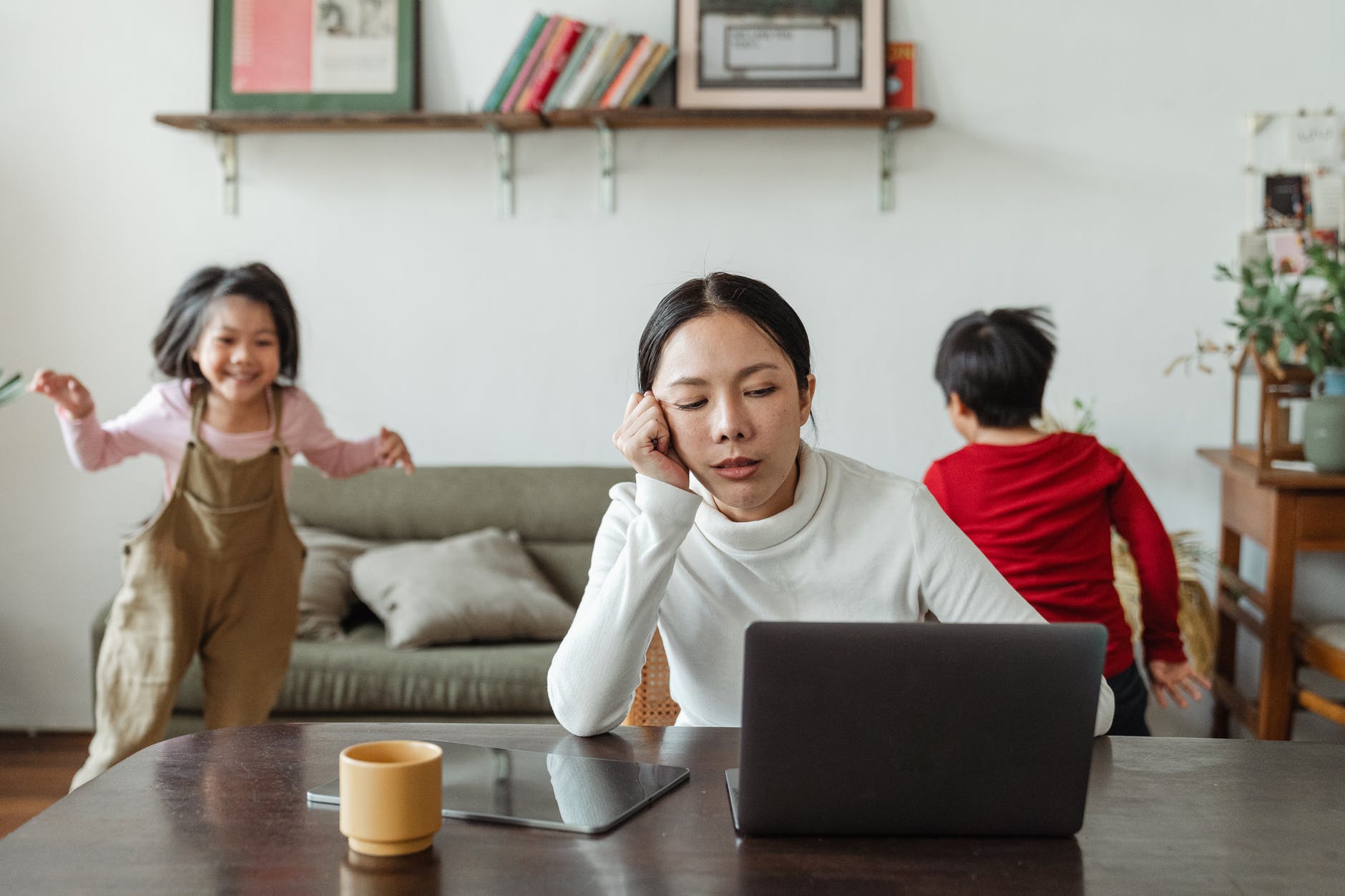 Kids making noise and disturbing Mom working at home.
