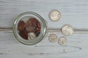 A few coins in a jar might represent what an author earns in royalties after earning out their advance.